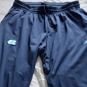 Navy blue Jordan/UNC joggers with carolina blue stripes.